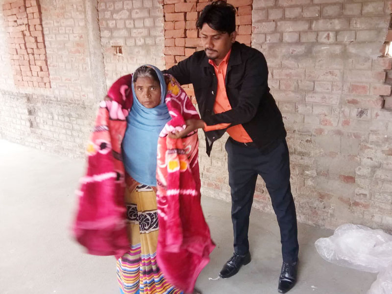 Providing warm blankets for poor elderly villagers in the cold winter months
