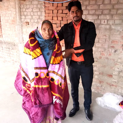 Providing warm blankets for poor elderly villagers in the cold winter months